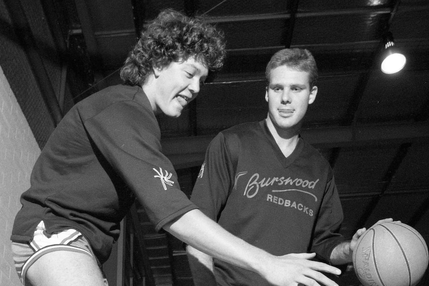 Black and white photo of a young Luc Longley and Andrew Vlahov