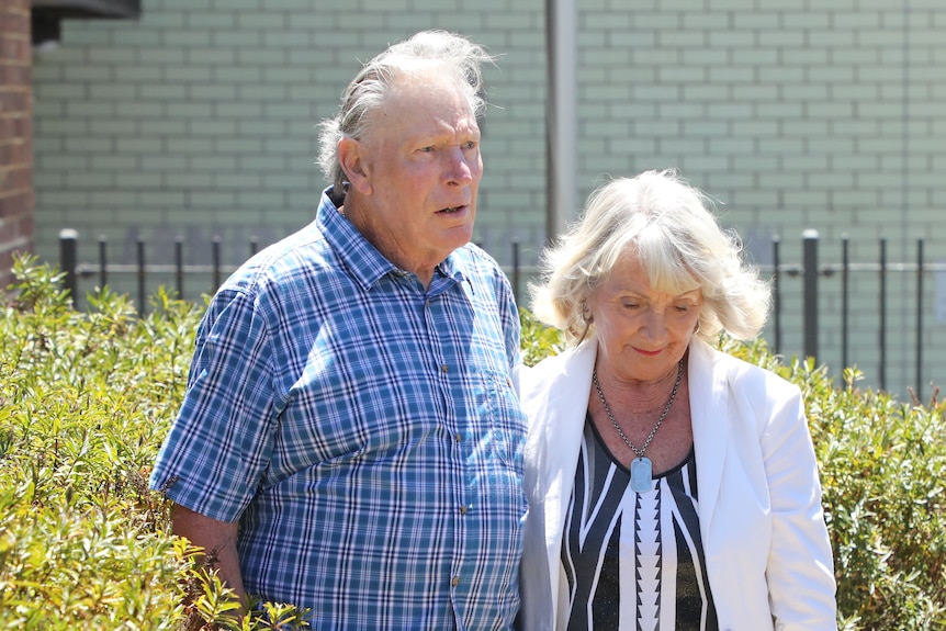 Phil and Patricia Page stand together outside Armidale police station