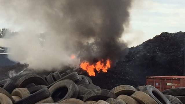 Tyres on fire at Tyremil business at Rocklea on Brisbane's southside