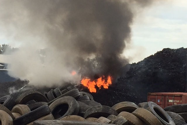 Tyres on fire at Tyremil business at Rocklea on Brisbane's southside