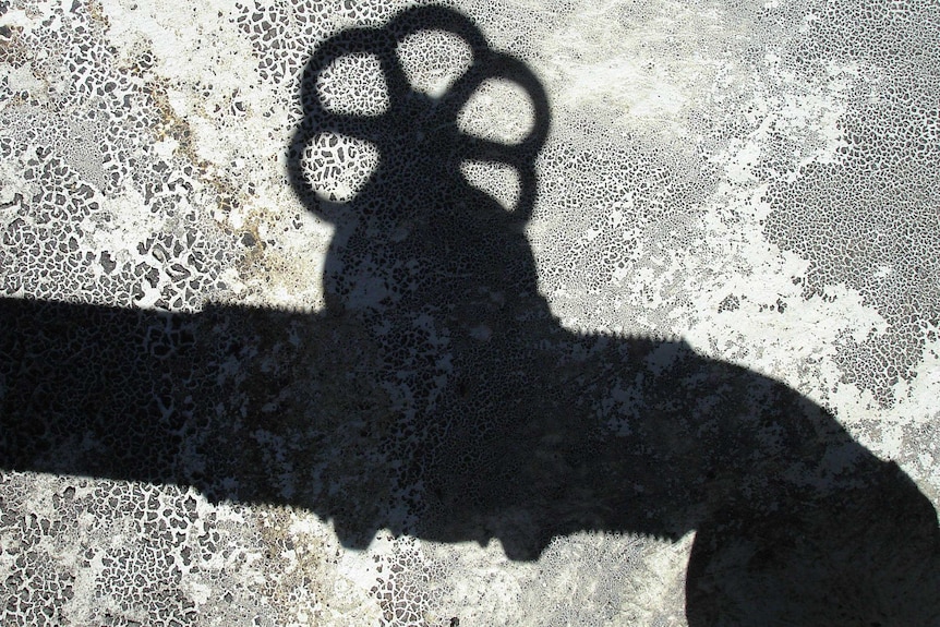 Shadow of a pipe and tap
