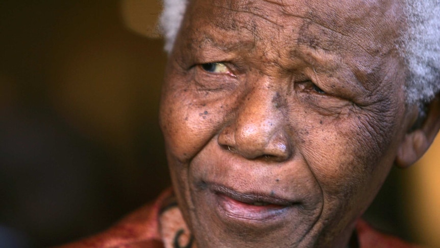 Nelson Mandela smiles as he formally announces his retirement.