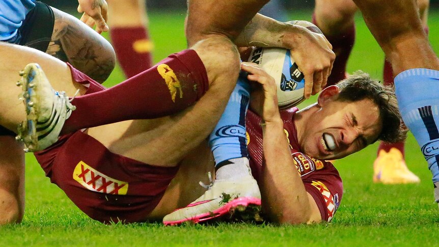 Season over ... Billy Slater after being tackled by the Blues in state of Origin II