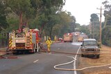 Fire trucks sit at the corner of Glenfern and Morris Road, Upwey