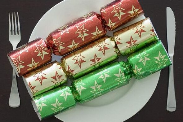 Christmas crackers on a plate.