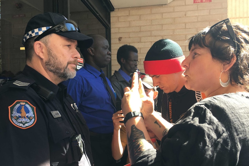 Security guards and police blocking the Alice Springs Supreme Court from protestors