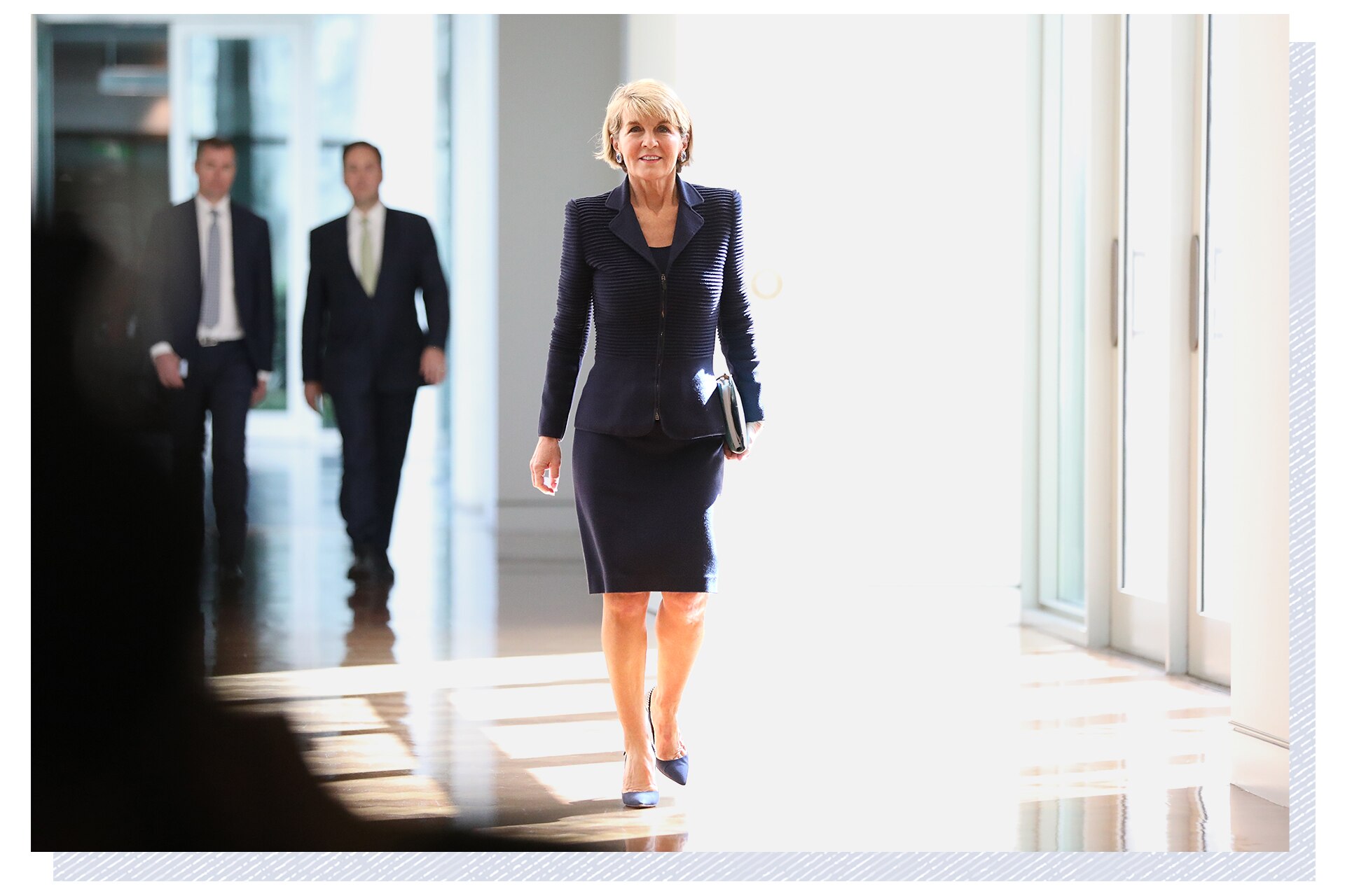 Julie Bishop walks down the hall.