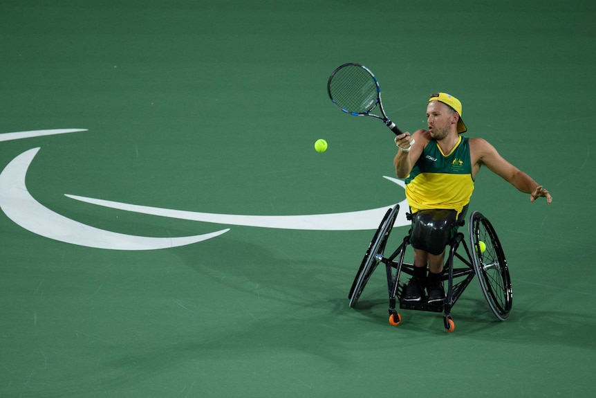 Australia's Dylan Alcott hits a return against Britain's Andy Lapthorne in quad tennis final