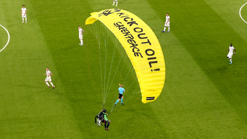 Euro 2020 protester narrowly avoids disaster in parachute stunt