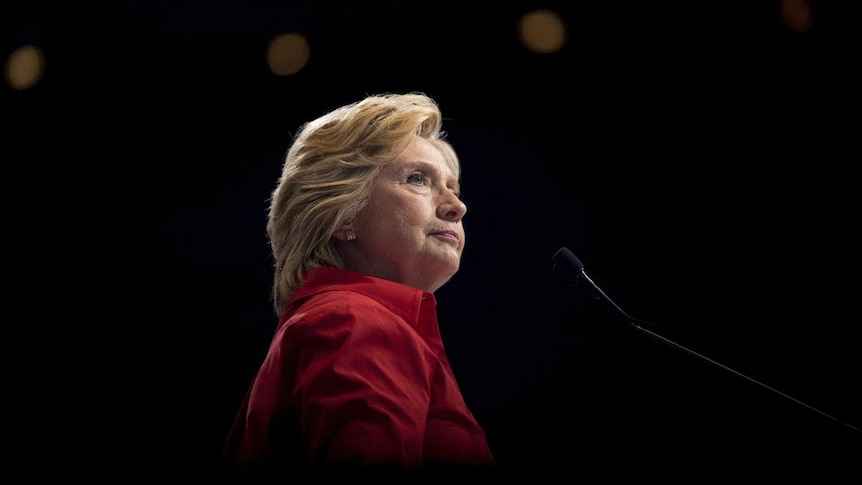 Hillary Clinton pauses and looks at the crowd during a rally.