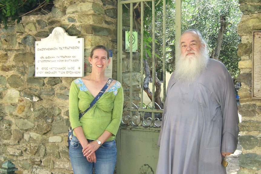 Dr Amelia Brown is pictured with the current priest of the St Nicholas Church in Thessalonike, Greece.
