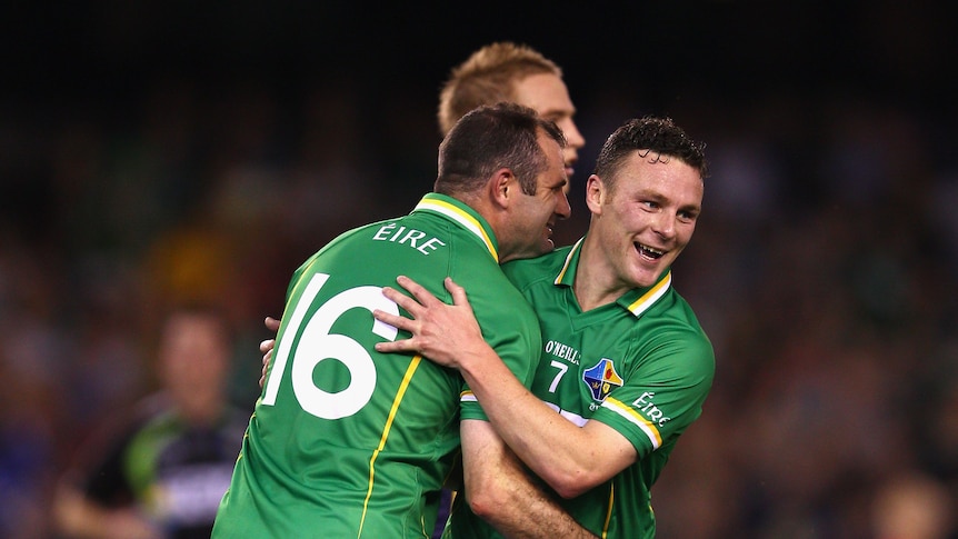 Luck of the Irish ... Leighton Glynn and Steven McDonnell celebrate a six-pointer at Docklands.
