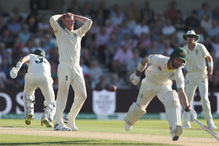 England bowler Ben Stokes puts his hands on his head as Marnus Labuschagne and Matthew Wade score runs during an Ashes Test.