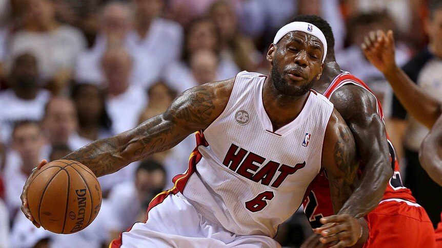 Offensive pressure ... LeBron James tries to beat the defence of Nate Robinson