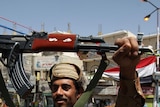 A Yemeni soldier joins anti-government protestors after switching allegiance to the opposition