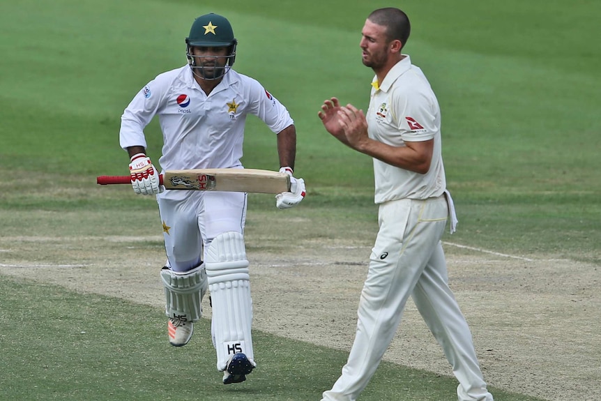 Mitch Marsh reacts as Pakistan's Sarfaraz Ahmed runs between the wickets during their test match in Abu Dhabi.