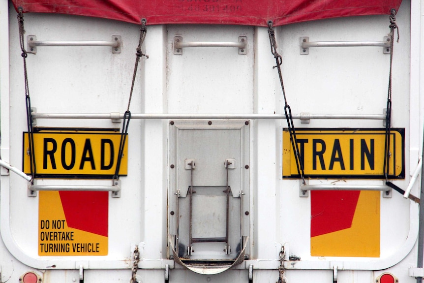 Road train sign on the back of a road train.