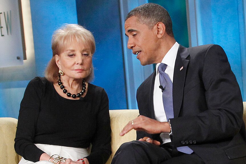 Barbara Walters and Barack Obama sit on a couch on the set of The View television show
