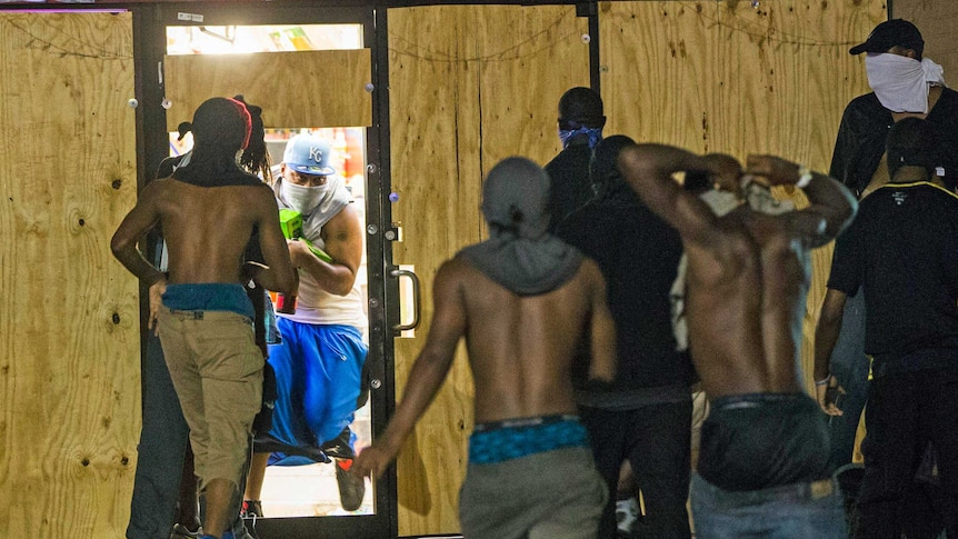 Looting at a liquor store in Ferguson