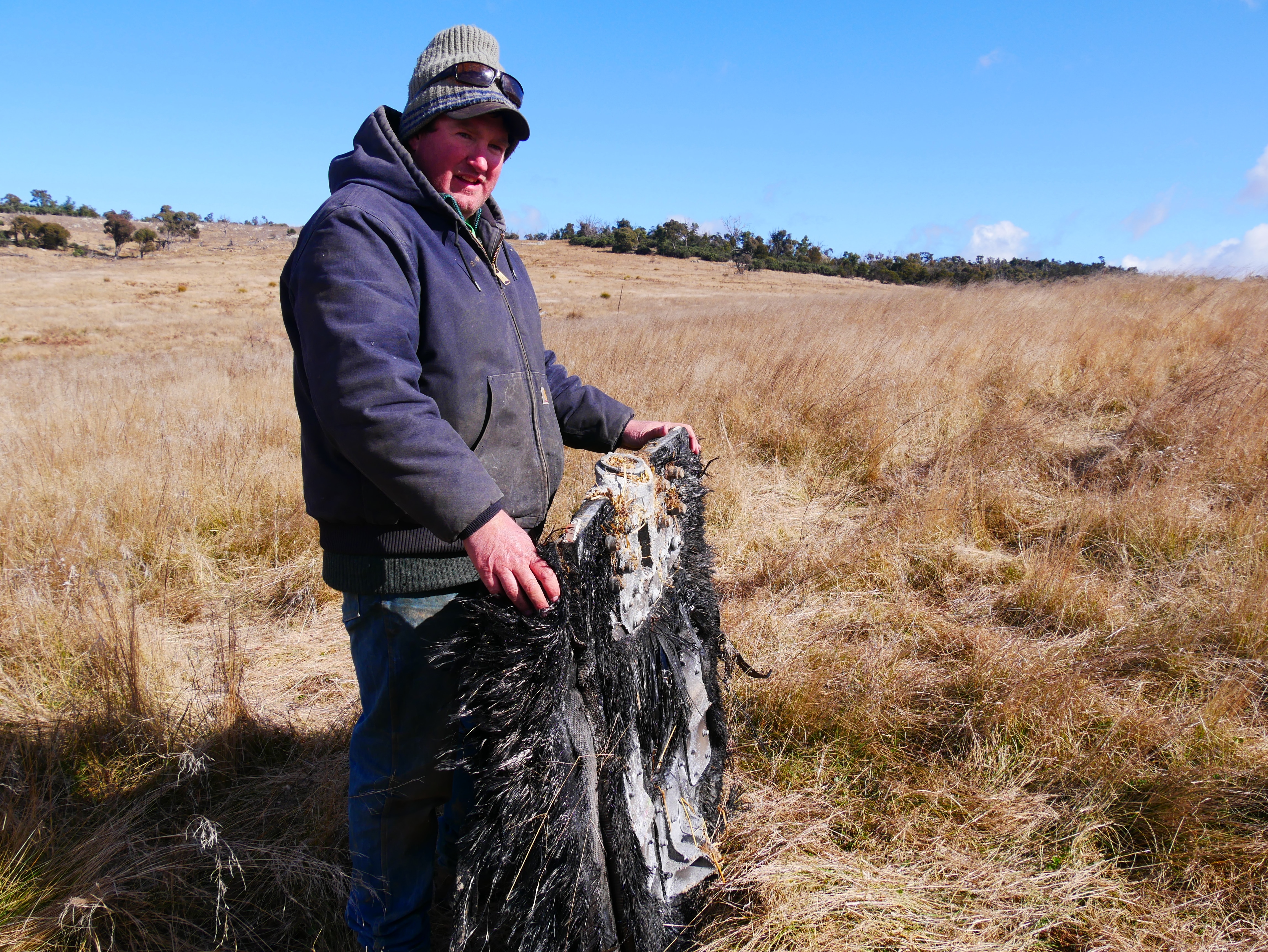 a man holds space junk