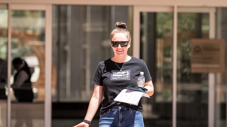 A woman leaving courthouse after being convicted for reckless driving.