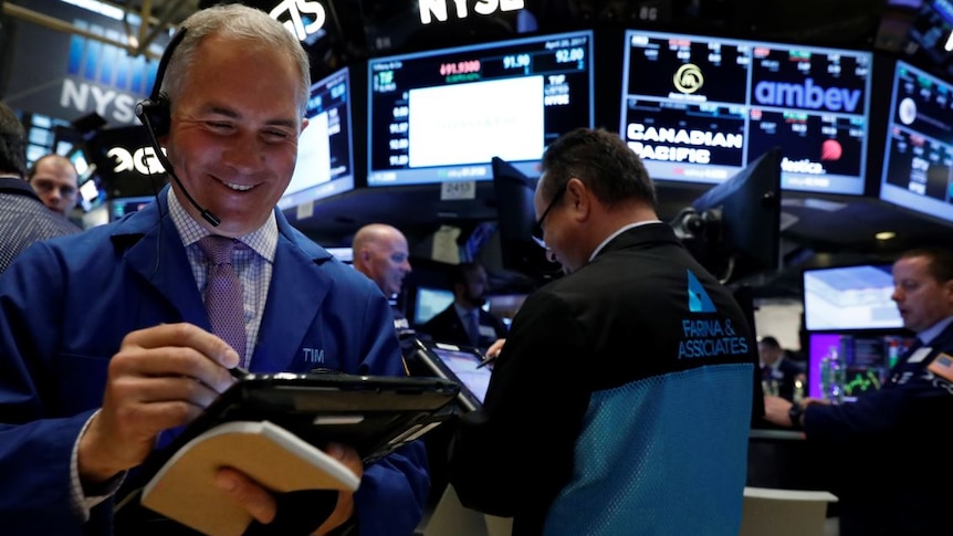 Traders work on the floor of the New York Stock Exchange.