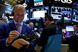 Traders work on the floor of the New York Stock Exchange.