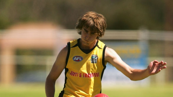 Justin Westhoff kicks at Port training