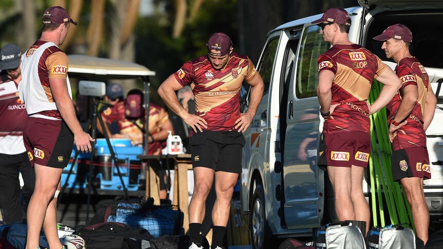 Cooper Cronk looks at his ankle during Origin training