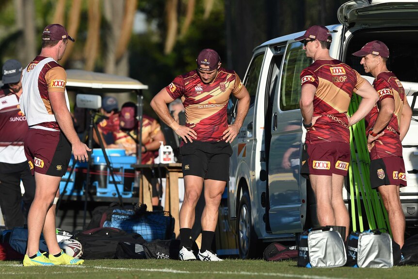 Cooper Cronk looks at his ankle during Origin training
