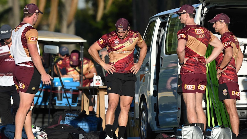 Cooper Cronk looks at his ankle during Origin training