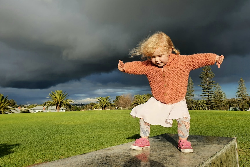 A child enjoying the wet weather in Perth.
