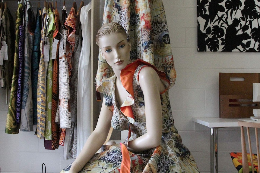 mannequin in a store with dresses