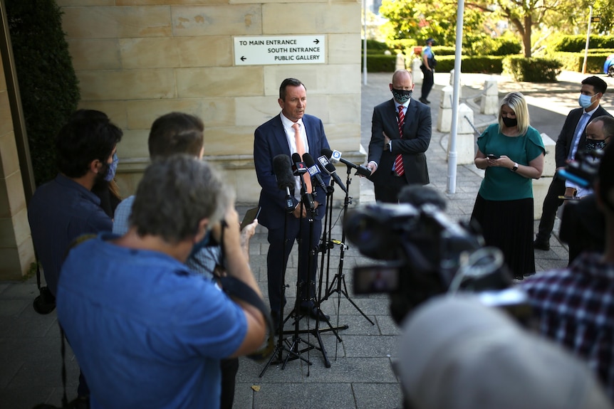Premier Mark McGowan and members of the media