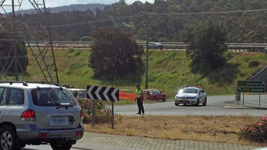 Police at the scene of a crash where a shot was fired at Hadspen, Tasmania
