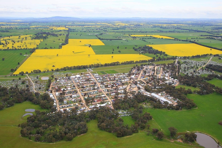 An aerial shot of the event surrounded by canola fields and grass.