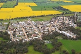 An aerial shot of the event surrounded by canola fields and grass.