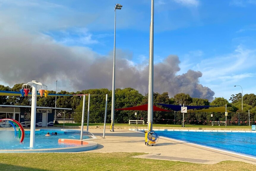 Dense smoke over a community pool.