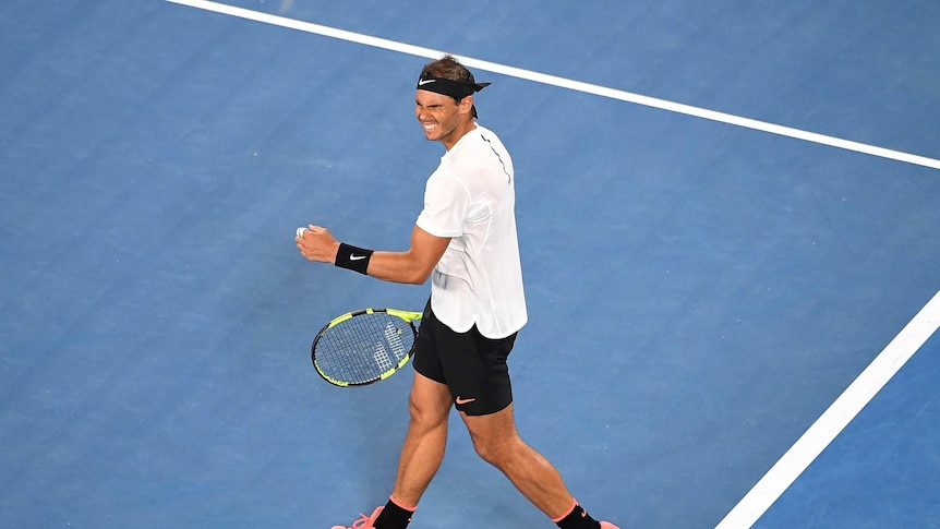 Rafael Nadal of Spain celebrates winning the Mens Singles match on day eight at the Australian Open.
