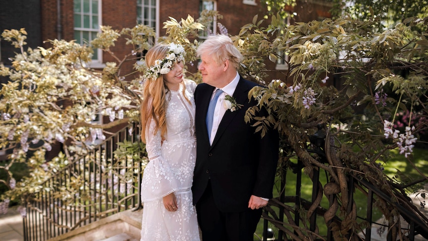 Boris Johnson and Carrie Johnson pose together for a photo in the garden of 10 Downing Street after their wedding