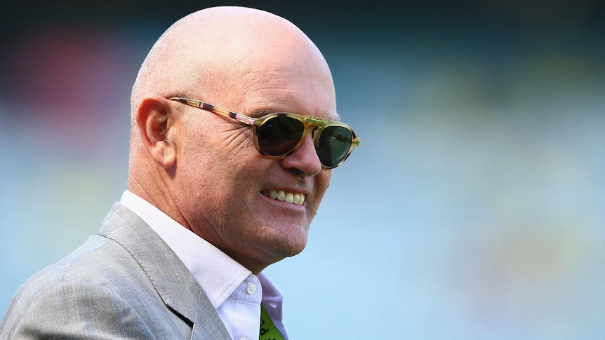 Former NZ cricketer Martin Crowe inspects the MCG pitch before the 2015 Cricket World Cup final.