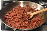 Cooking Funky Fields plant-based "minced" in a pan.