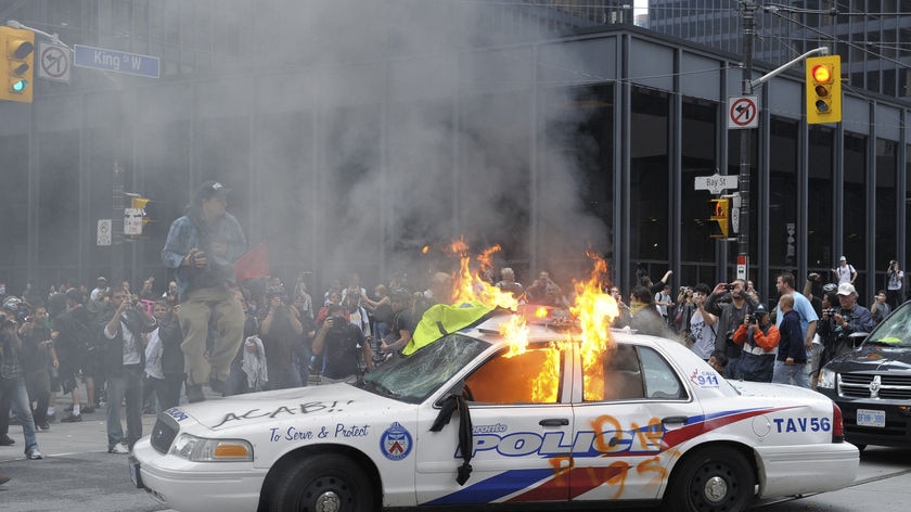 A police car set on fire by demonstrators during the G20 in Toronto in 2010.