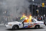 A police car set on fire by anarchist demonstrators at the G20 summit