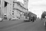 An old image shows a tram running through Hobart.