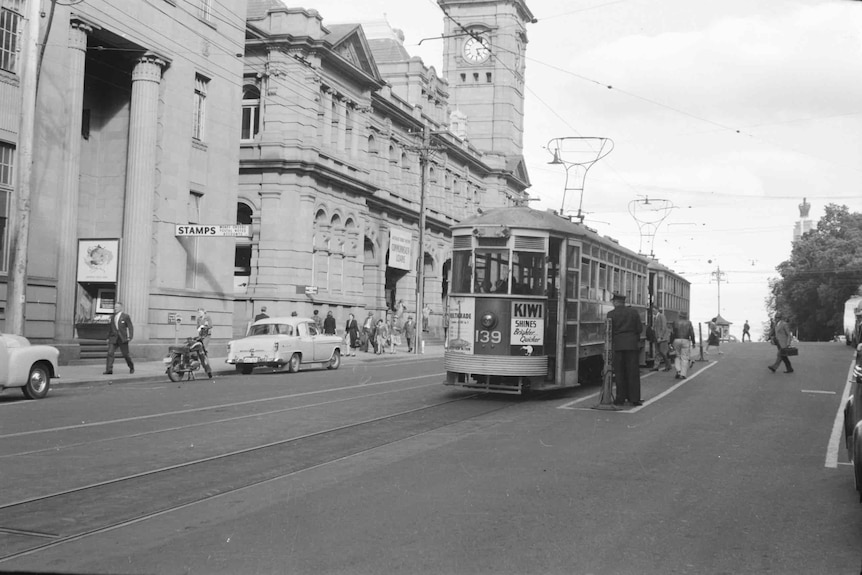 An old image shows a tram running through Hobart.