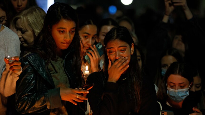 Hundreds mourn murdered London teacher as police release suspect