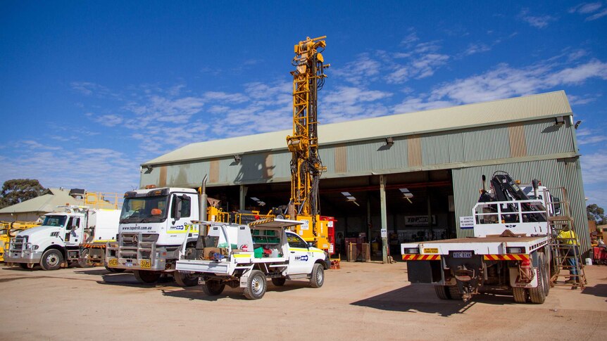 Exploration drills and trucks parked up in a yard in Kalgoorlie, Western Australia
