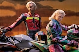 A 2022 press shot Flume and MAY-A posing on motorcycles with sportswear jackets
