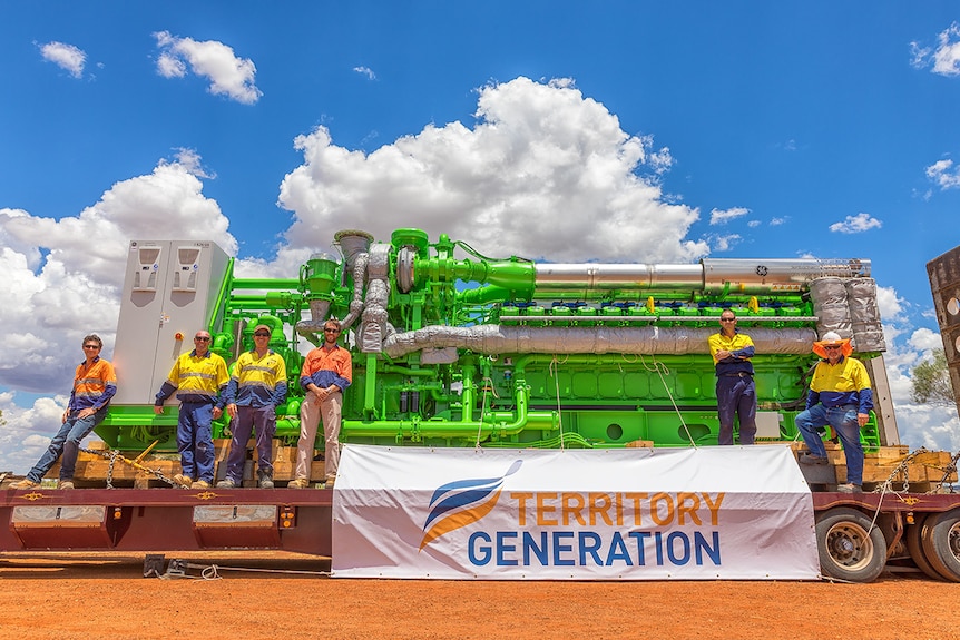 Workmen on a truck with a Territory Generation banner.